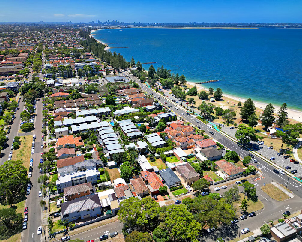 Aerial across Brisbane Beach in Queensland