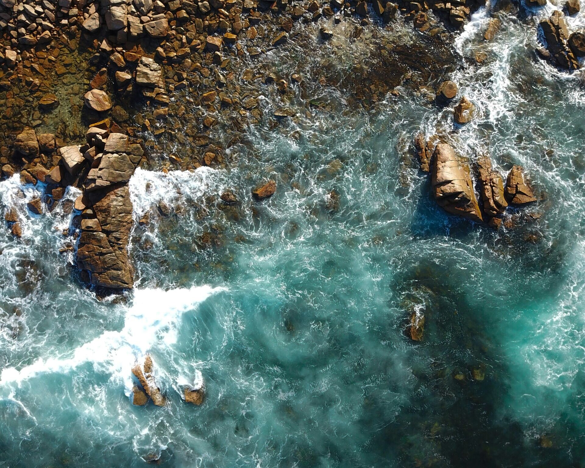 Aerial across Rocky Sea