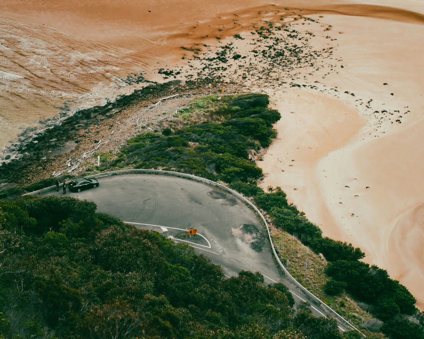 An aerial of road upon a beach